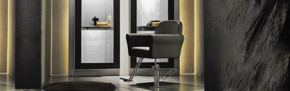 a classic image of a hair salon with chair and mirror