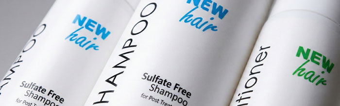 close-up image of hair shampoo and conditioner bottle