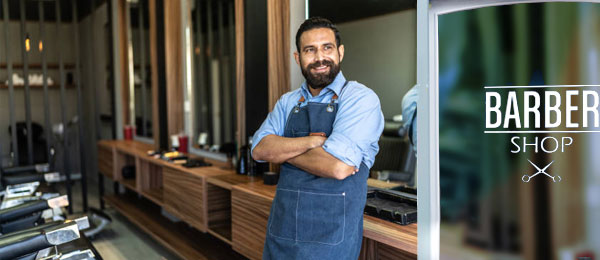 happy barber looking outside